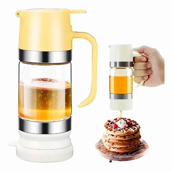 Meldora no-drip honey dispenser with a yellow lid and clear glass bottle, shown pouring onto waffles